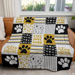 Golden dog paw print throw blanket view 3 highlighting patchwork pattern squares, bones, and stripes