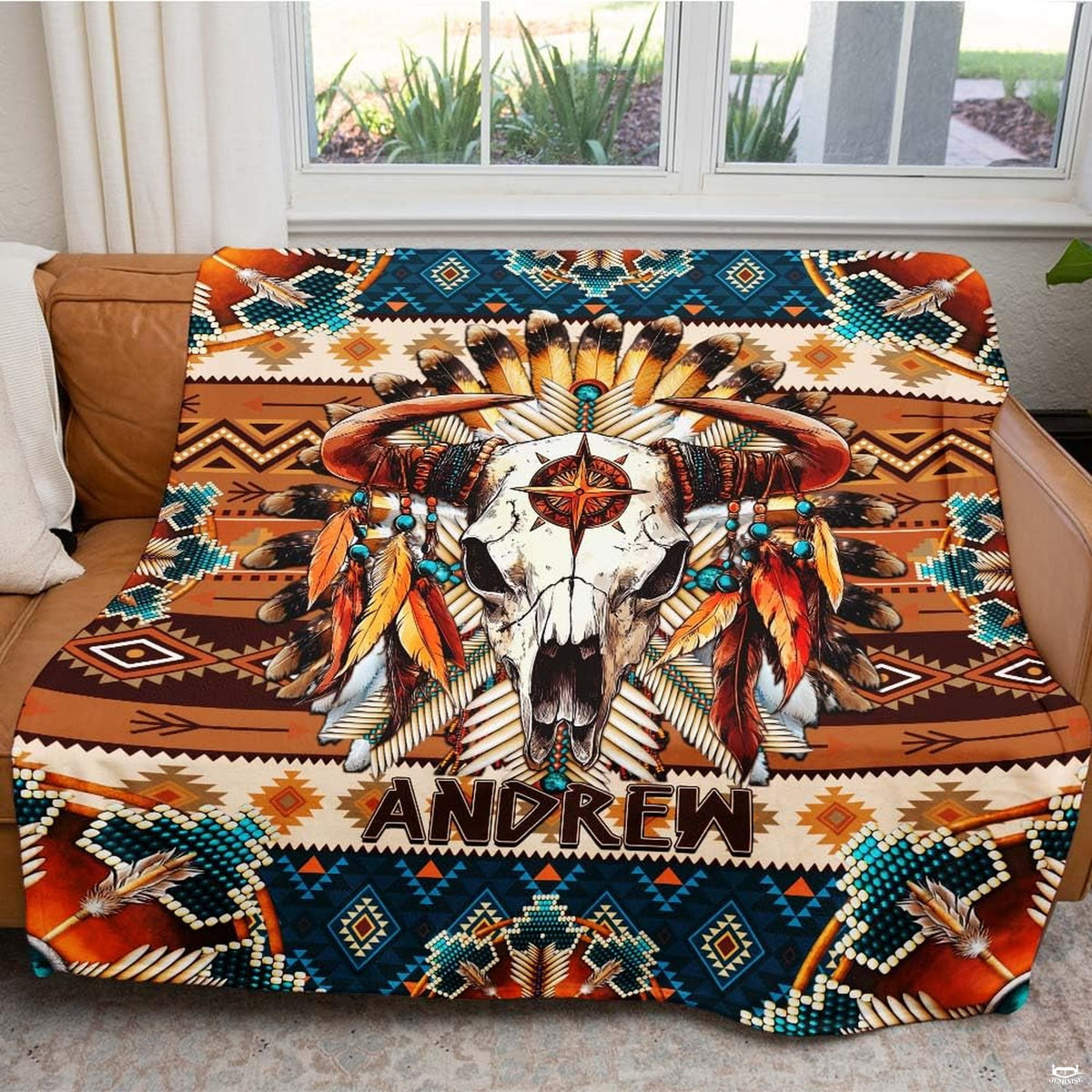 Full flat lay of the Southwestern bull skull tribal feather blanket composition.