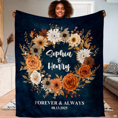 Autumn floral wreath navy throw blanket held open showing rich botanical circular garland artwork