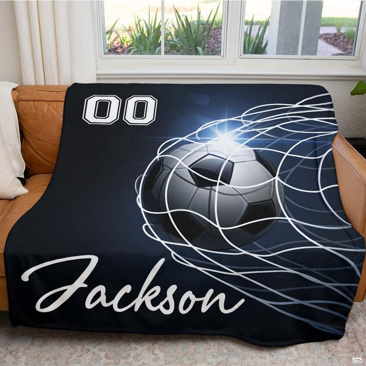 Close view of soccer ball bulging net cords with light flare graphic