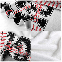 Close up of baseball jersey throw blanket displaying distressed number texture and red cursive font