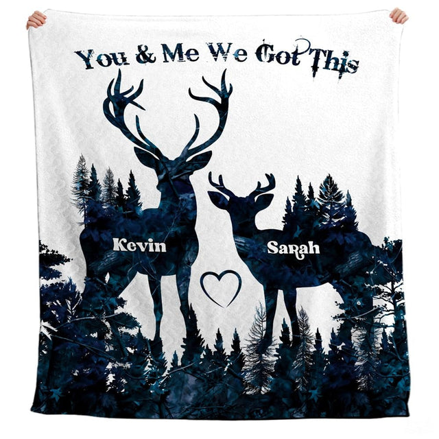Angled view of midnight blue double-exposure forest deer bedding in a modern bedroom.