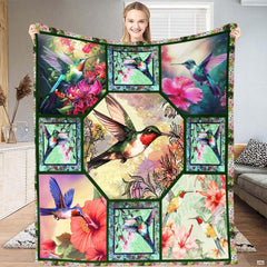 Botanical birds bedding featuring hummingbird and tropical floral collage panels in vibrant emerald and coral.