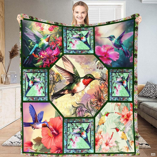 Botanical birds bedding featuring hummingbird and tropical floral collage panels in vibrant emerald and coral.