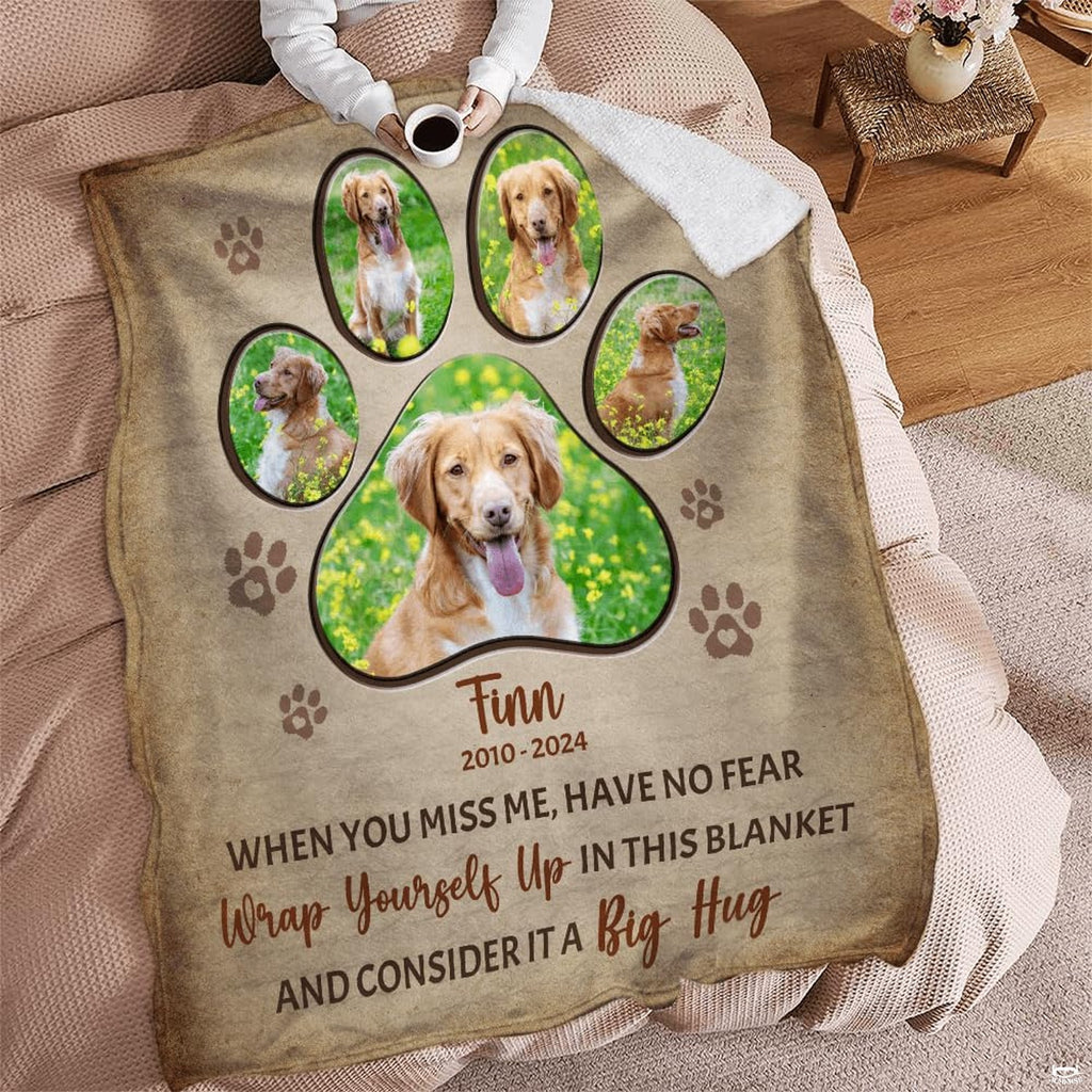 Reading corner lifestyle scene displaying dog memorial paw print throw blanket near an armchair.