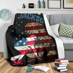 Patriotic lineman sports graphic blanket styled across bedroom bed