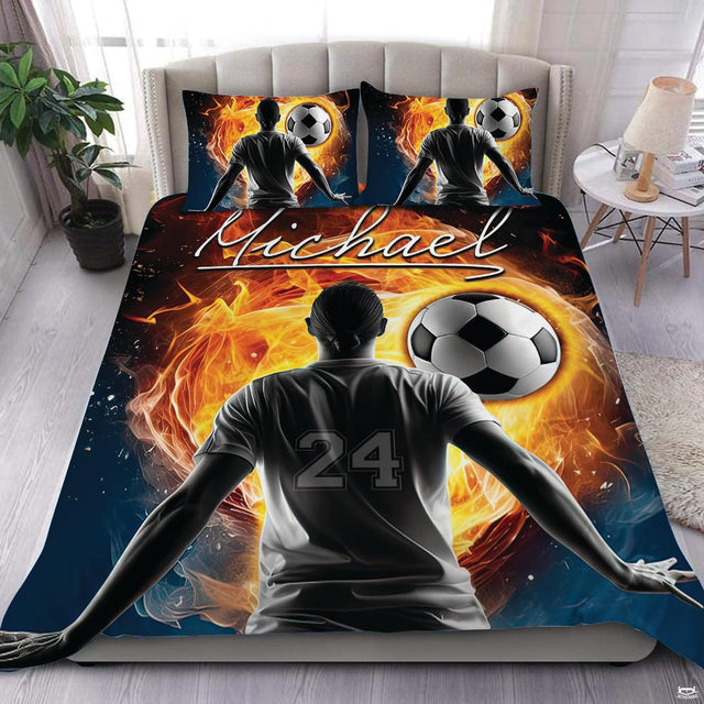 Blazing fire soccer ball flame athletic bedding set displayed neatly on a bed in a sports bedroom