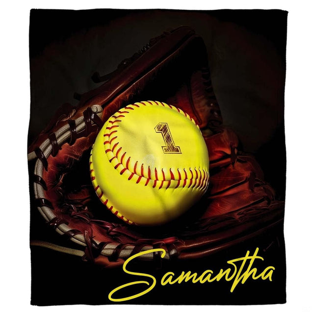 Optic yellow softball in fielder mitt sports blanket with dark backdrop