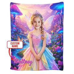 Folded blanket showing pastel rainbow gown and glowing turquoise mushroom caps.