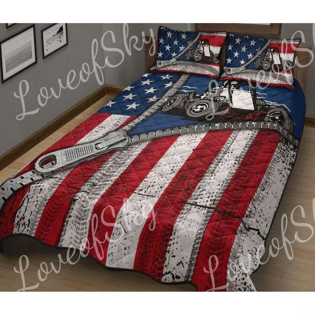 Side view of patriotic sprint car bedding showing textured dirt track graphics and checkered flag accents