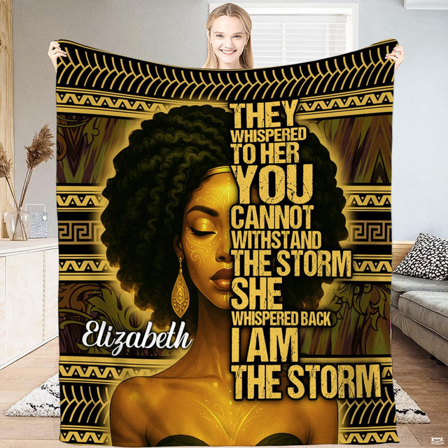Afrocentric blanket featuring a woman portrait with natural hair and golden tribal geometric borders.