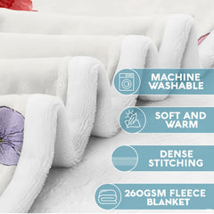 Close-up view of carnation reader girl throw blanket highlighting delicate flower petals and butterfly print.