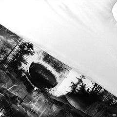 Detail of wolf nose, pine silhouettes, line structures, and white reverse