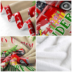 Christmas red truck dogs holiday throw blanket styled across contemporary sofa beside holiday decor