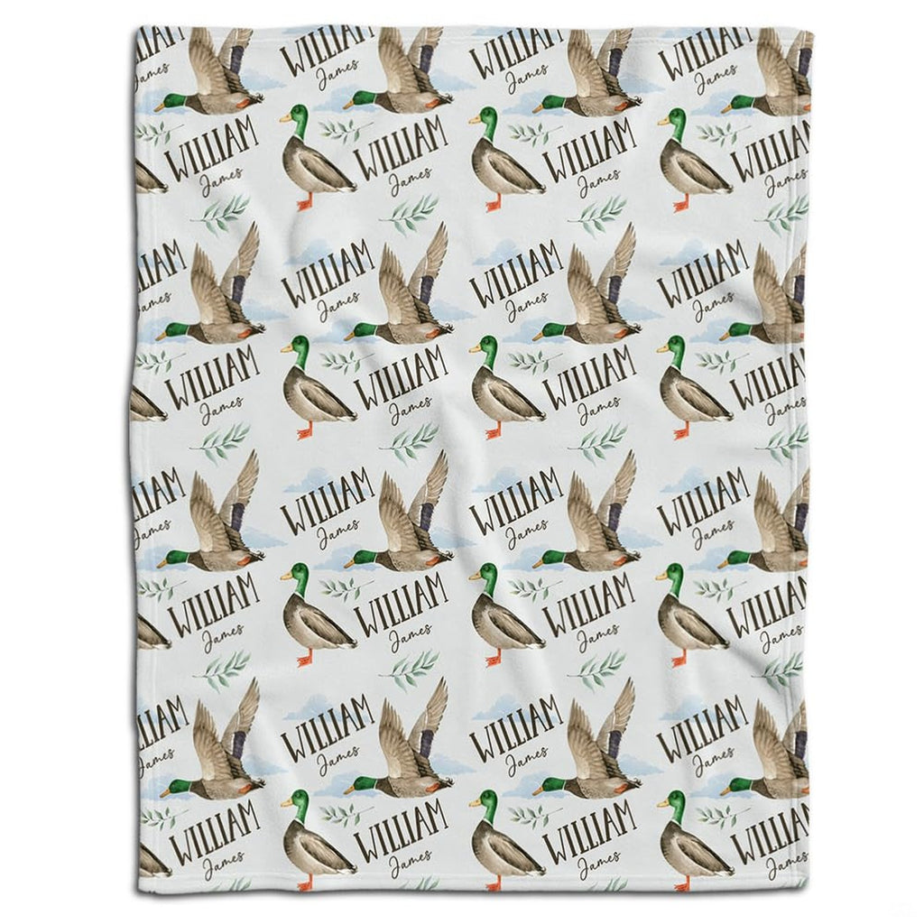 Mallard duck bedding set showcasing standing and flying waterfowl pattern with botanical greenery sprigs on white ground