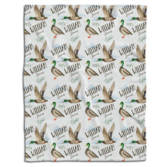 Mallard duck bedding set showcasing standing and flying waterfowl pattern with botanical greenery sprigs on white ground