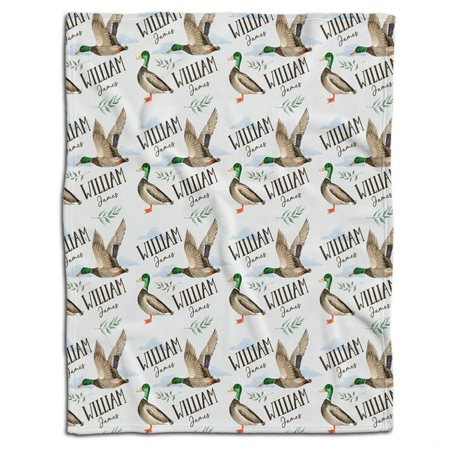 Mallard duck bedding set showcasing standing and flying waterfowl pattern with botanical greenery sprigs on white ground