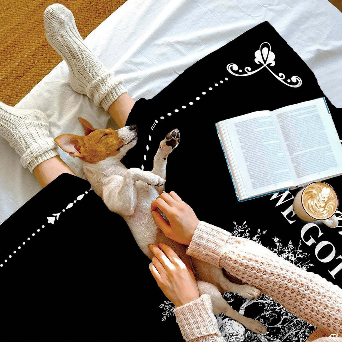 High-contrast black and white artistic tree illustration on bedding set within a modern bedroom setting.