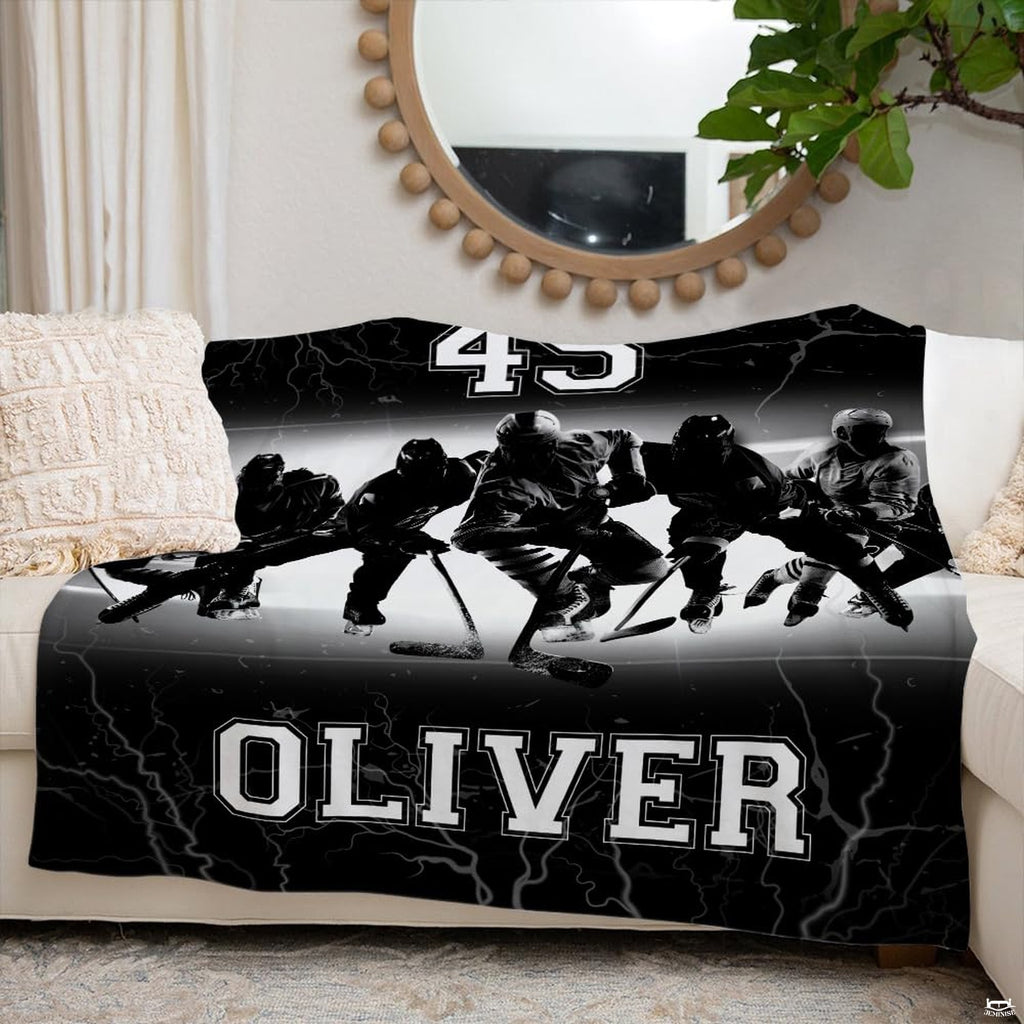 Ice hockey team sports blanket styled neatly across an ivory living room couch.