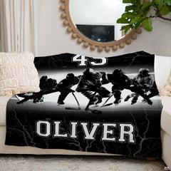 Ice hockey team sports blanket styled neatly across an ivory living room couch.