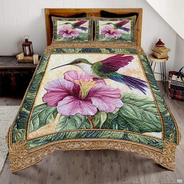 Green hummingbird with magenta wing above pink hibiscus in a gold frame
