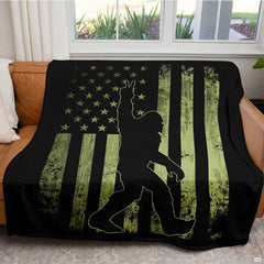 Close up of tactical Bigfoot throw blanket highlighting olive drab stripes and distressed star field