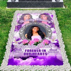 Purple memorial tribute grave blanket displayed on lawn framed by white pebbles