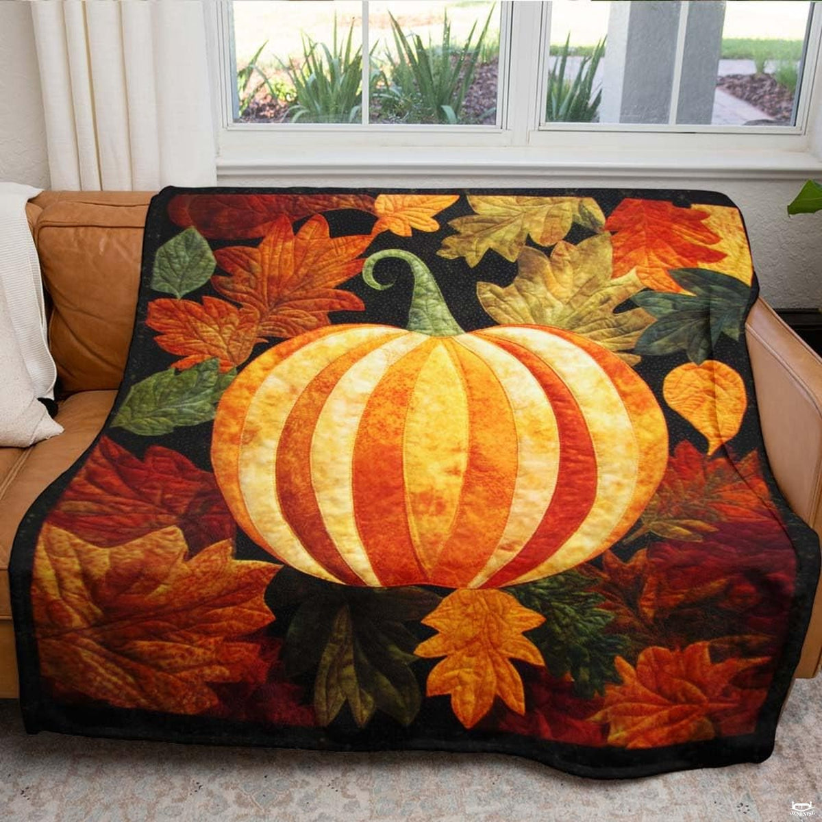 Thanksgiving home decor setting featuring autumn pumpkin throw blanket