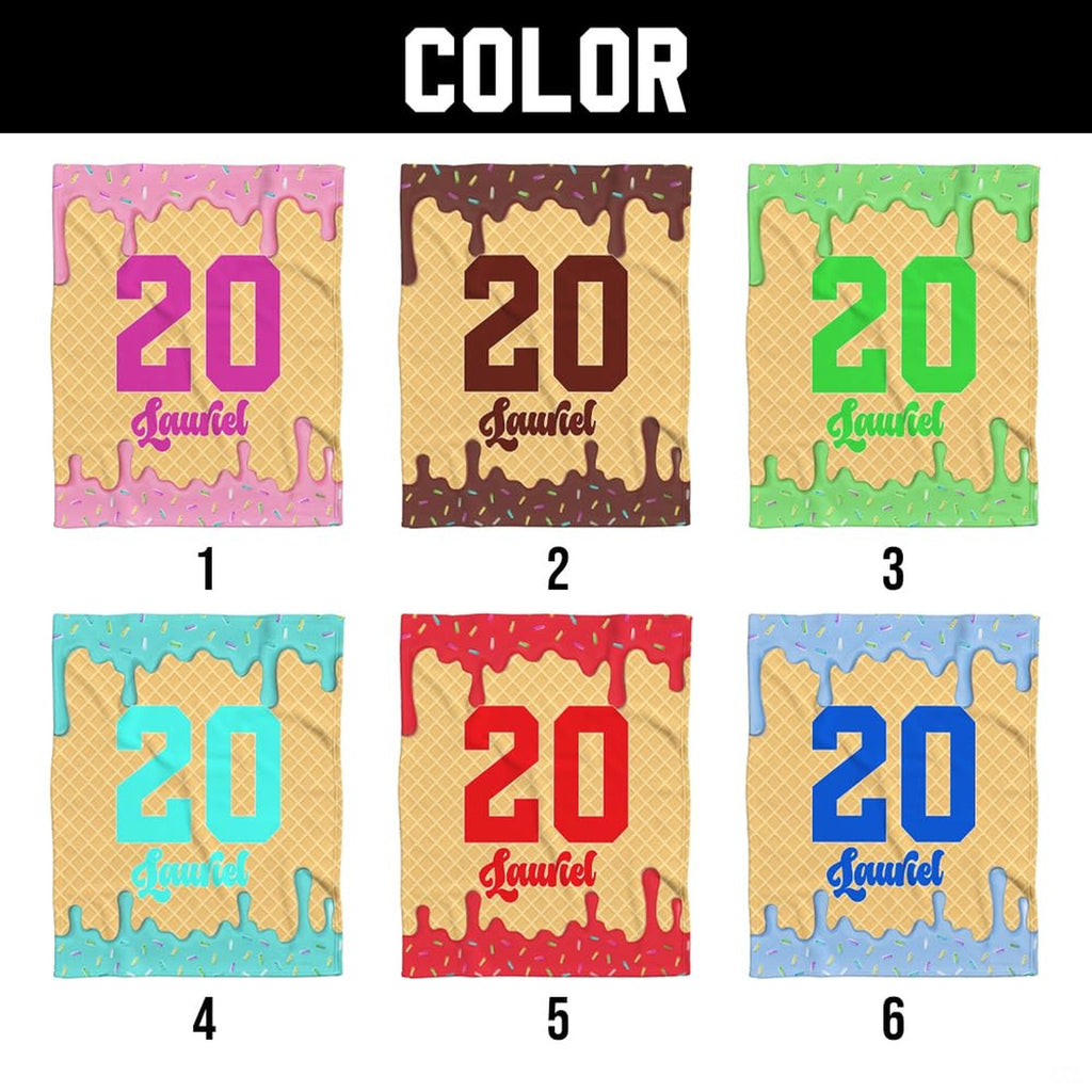 Detailed view of white softball batter graphic and colorful sprinkles on athletic throw blanket.