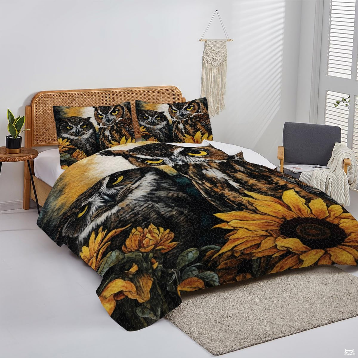 Overhead perspective of owl bedding arranged neatly across a mattress with woodland room decor