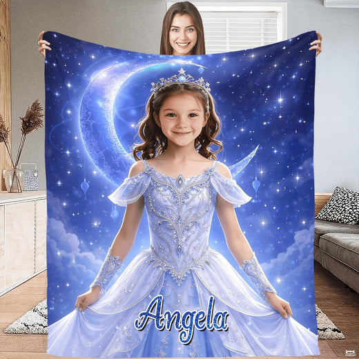 Celestial princess blanket flat display showing girl in icy blue gown before a glowing crescent moon and stars.