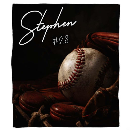 Vintage baseball glove and ball throw blanket held open by woman