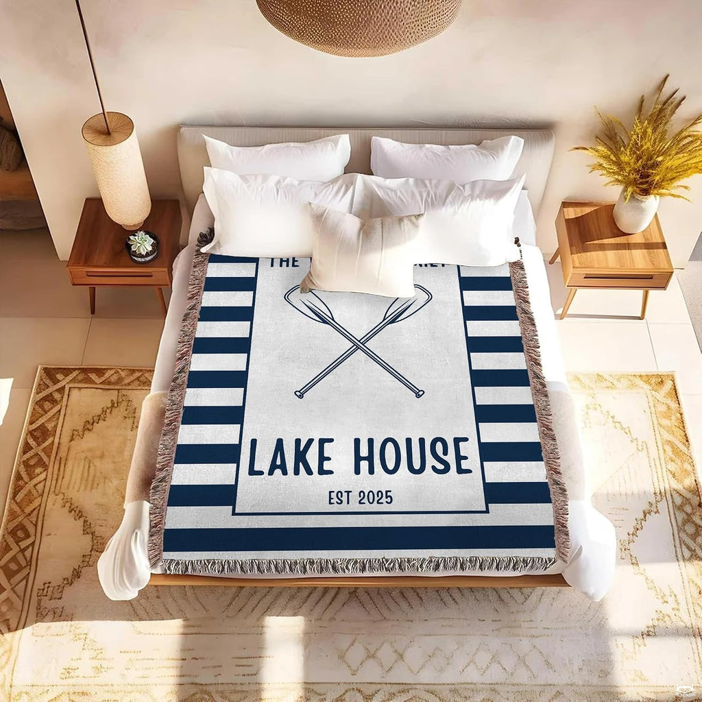 Bedding set display featuring nautical navy and white stripes with rustic oars.