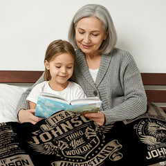 Bedding displayed on bed showcasing structured multi-panel grid collage in thematic accent cream and charcoal tones.