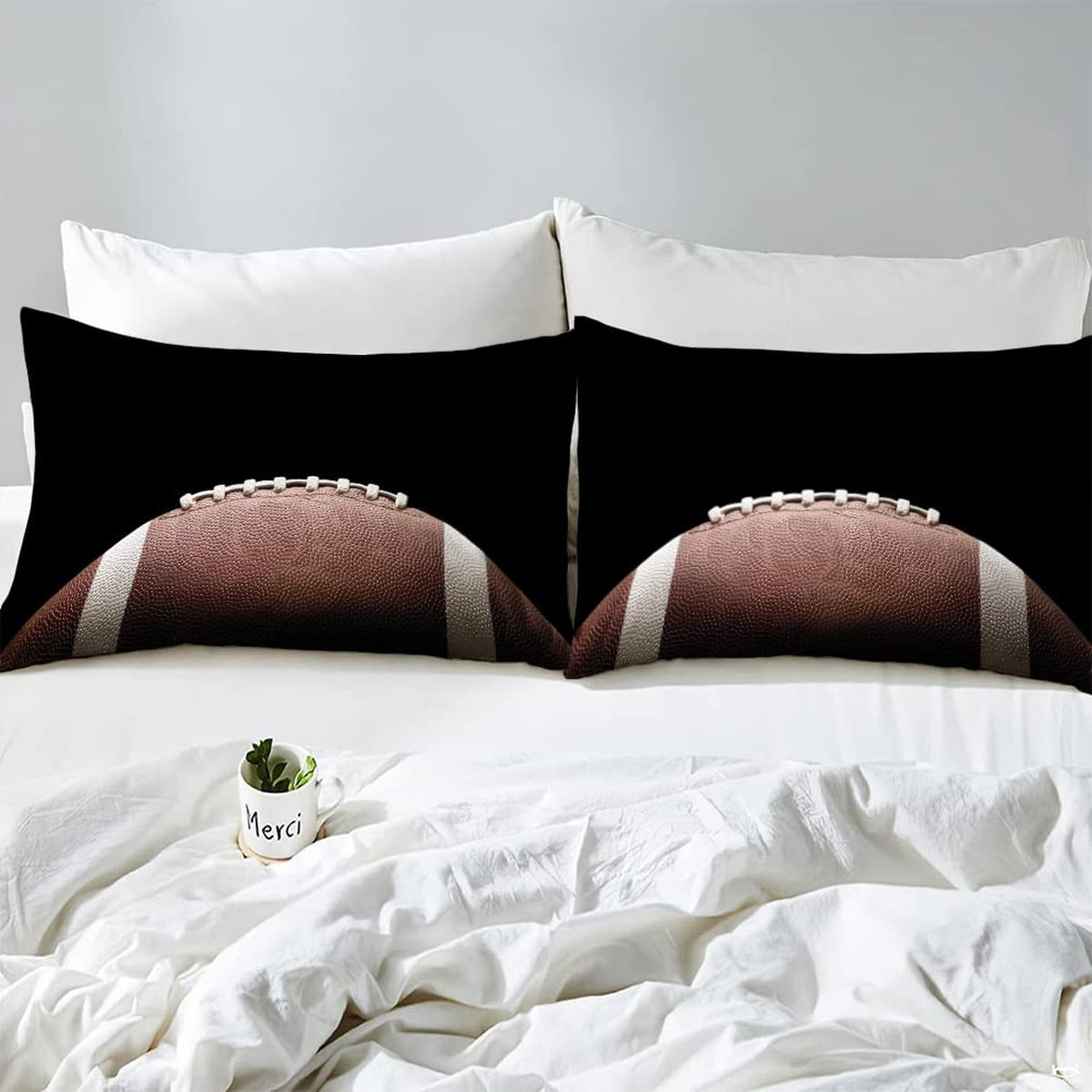 Corner fold view of football bedding highlighting sharp graphic printing on dark background