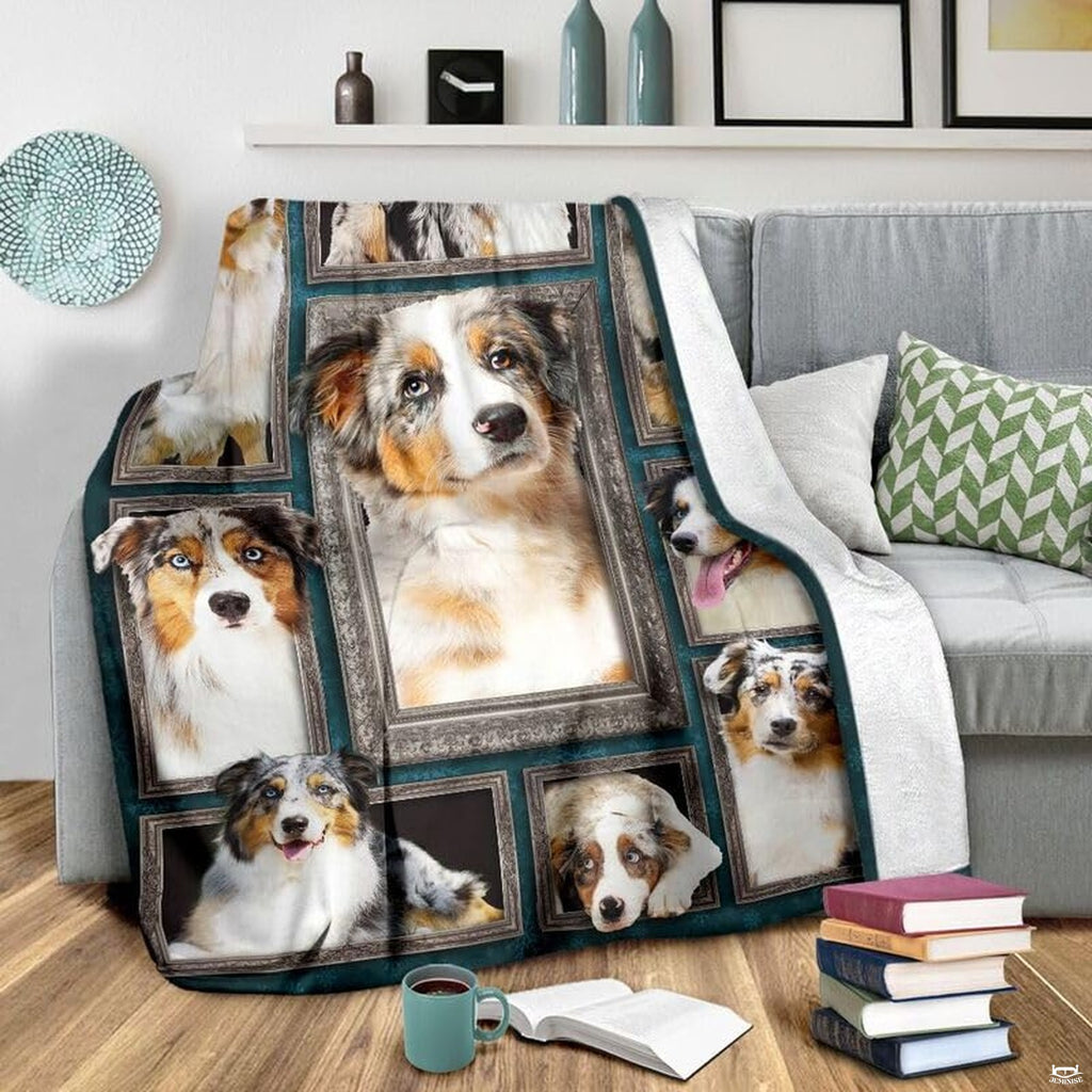 Grey couch arrangement featuring the Australian Shepherd blanket draped beside patterned pillows.
