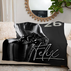 Detailed view of varsity athletic numbering and player muscular detail on football throw blanket