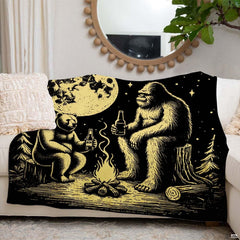 Side angle of the gold bedding set showcasing the bear and Sasquatch campfire graphics in warm room lighting.
