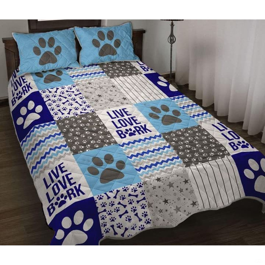 Dog themed bedding set with paw prints, bone motifs, and chevron patterns in an animal themed bedroom.