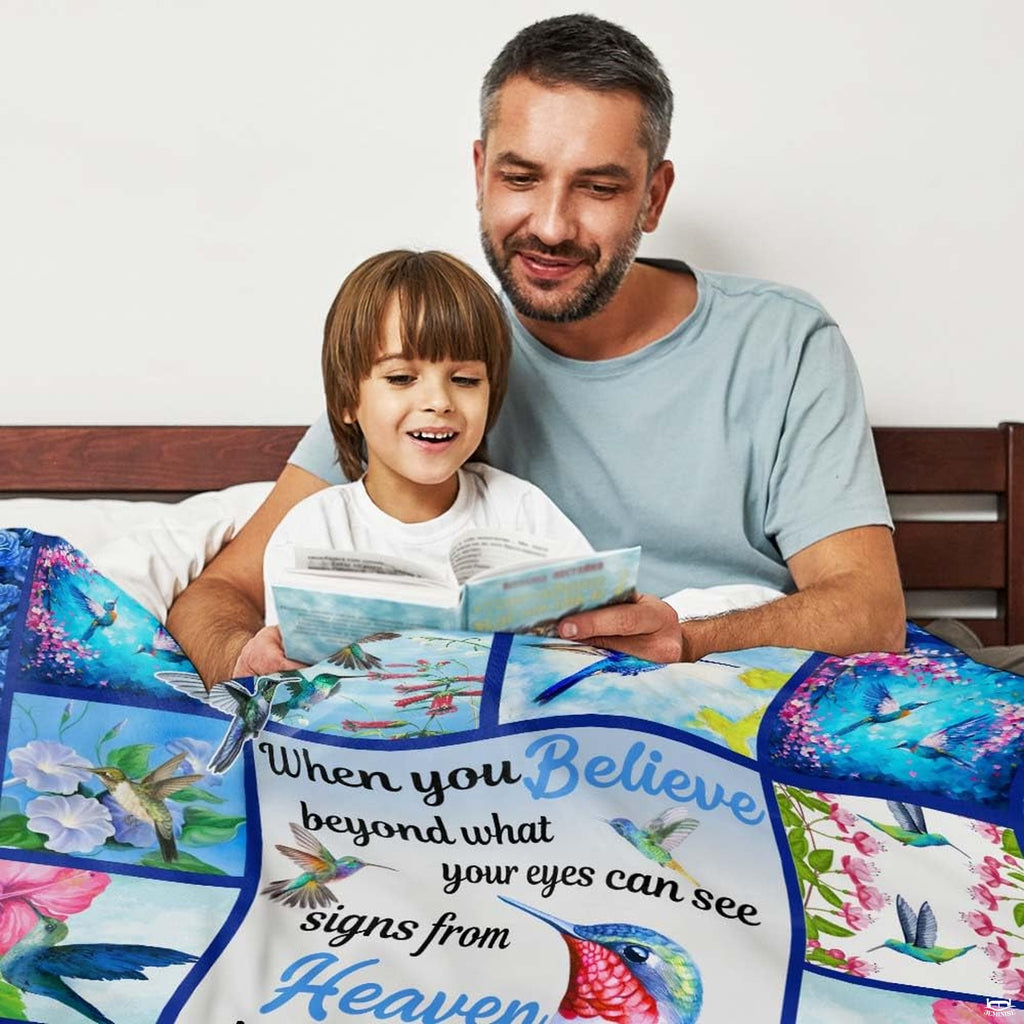 Hummingbird floral collage throw blanket view 3 highlighting iridescent bird artwork and garden room styling