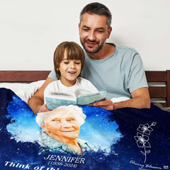 Memorial portrait artwork with celestial stars and swirling clouds draped during a quiet family moment