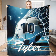 Soccer ball bed set artwork showing a soccer ball in the net with cyan stadium floodlights and navy background.