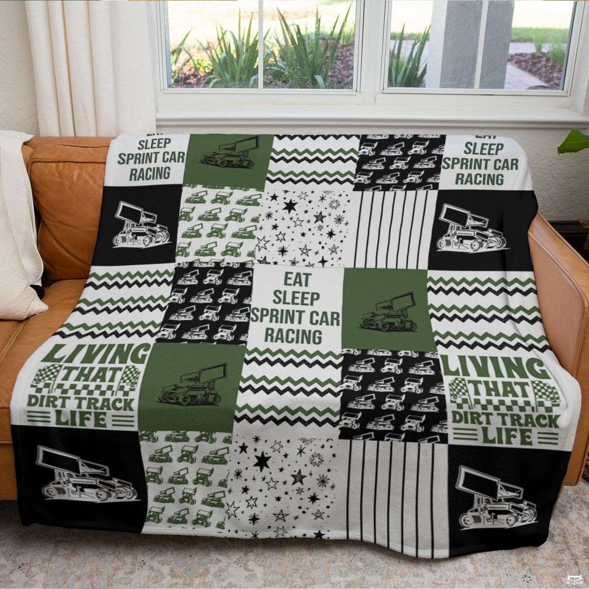 Angled bedroom view displaying the motorsport collage bedding set with crisp white stripes and thematic accent thematic...