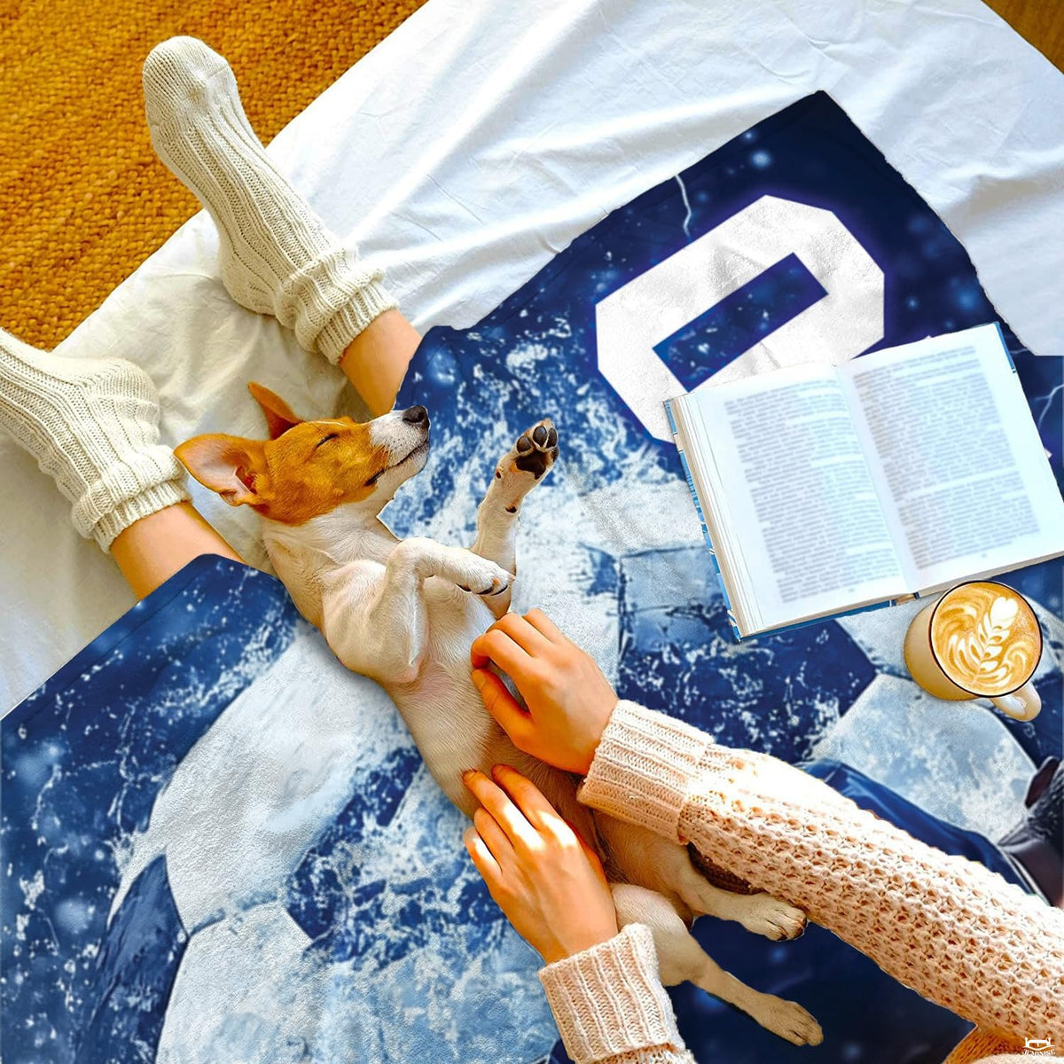 Bedding styled in a modern sports bedroom setting highlighting vibrant blue and amber decorative tones.