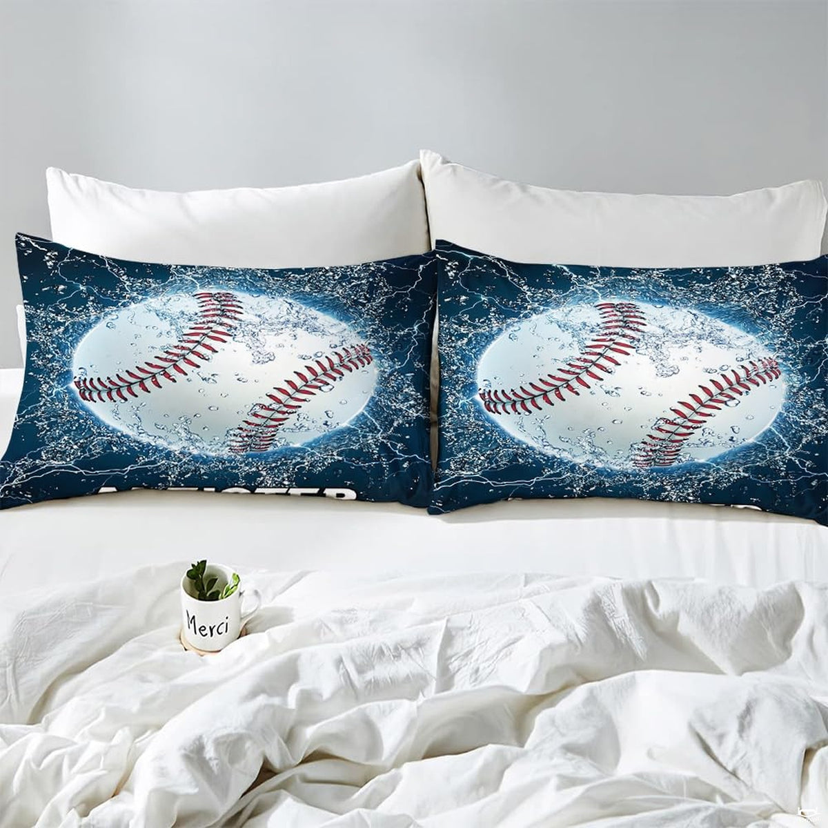 Side angle view of athletic sports bedding showing ice blue and slate grey tones draped on mattress