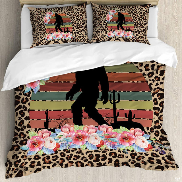 Retro Bigfoot silhouette with striped sunset and watercolor flowers on cheetah print bedding.