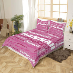 Close-up perspective of pink typography bedding showing textured chalk lettering and calligraphy brushstrokes
