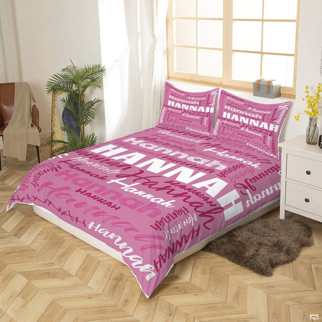 Close-up perspective of pink typography bedding showing textured chalk lettering and calligraphy brushstrokes