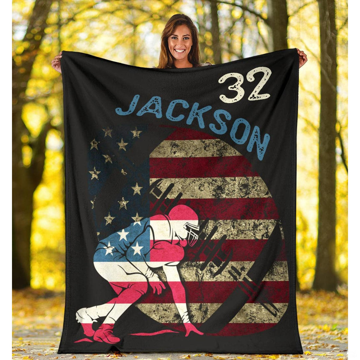 Folded athletic blanket highlighting circular flag graphic and goalpost