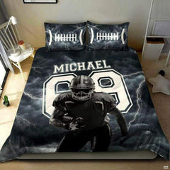 Russet brown football sports bedding featuring textured football graphic and yard lines on dark backdrop on a bed